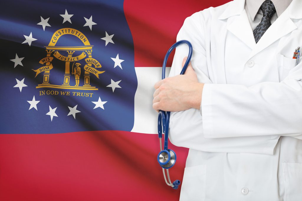 doctor in front of georgia state flag